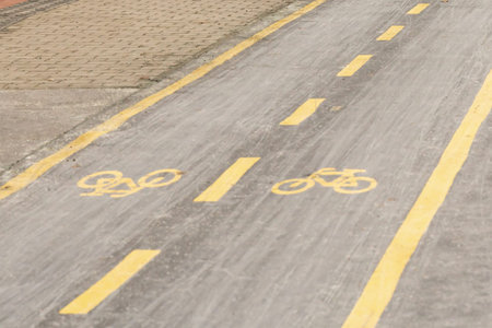 bike path signpost on asphalt, city transport safetyの写真素材