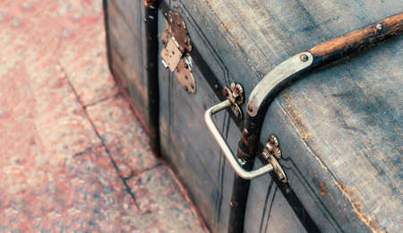 suitcase close up with iron handle in retro style for storage and travelの写真素材