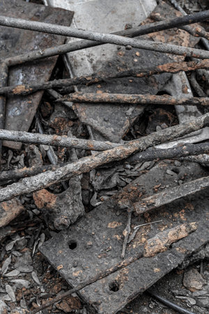 iron trash piled on the ground old and weathered vertically