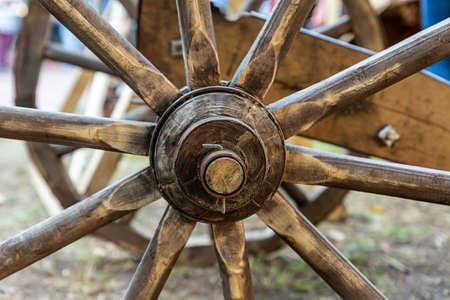 spokes of a wooden cartwheel dark brown closeupの写真素材