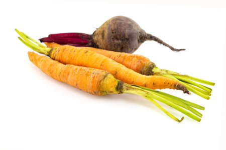 beetroot and carrot root vegetables autumn harvest on white isolated background