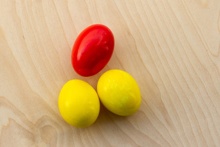 pair of yellow eggs and red festive set decor easter