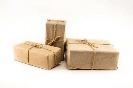 giftbox set in brown craft packaging on white isolated backgroundの写真素材