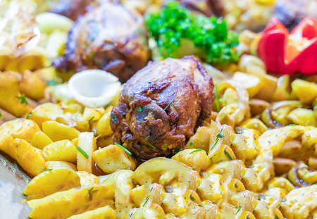 fried pork shank with potatoes traditional dish at european christmas market selective focusの写真素材