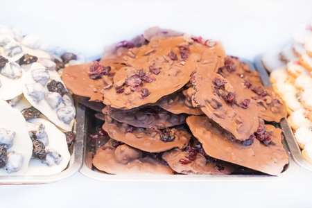 hand made sweets dark chocolate and white close up on isolated backgroundの写真素材