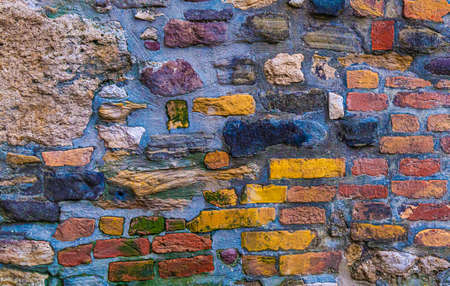 old weathered brick wall of a house, urban background close upの写真素材