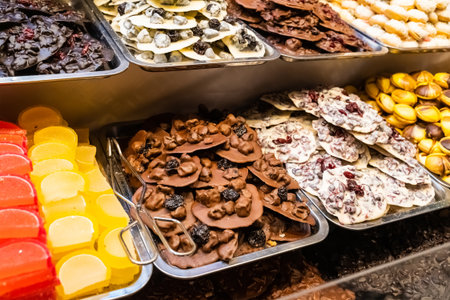 assorted handmade chocolate with various fillings, prunes and cranberriesの写真素材