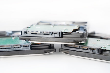 several hard drives for a computer close-up on a light backgroundの写真素材