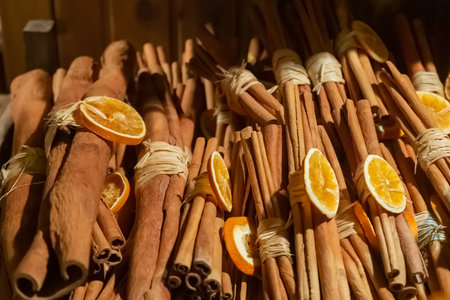 christmas decor cinnamon sticks and orange, culinary backgroundの写真素材