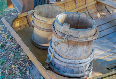 old wooden buckets for water from boards, a couple of vesselsの写真素材