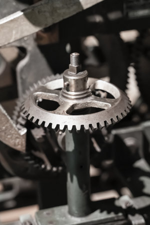 gray steel gear part of a large mechanism close-upの写真素材
