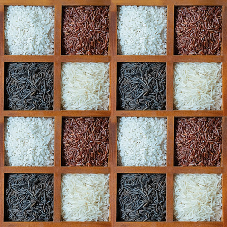 pattern of rice white and red in wooden cells background culinaryの写真素材