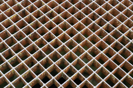 metal lattice of honeycombs close-up, geometric patternの写真素材