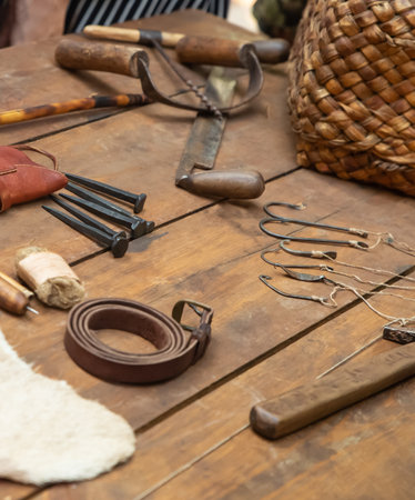 leather carving tools, vintage tools on the tableの写真素材