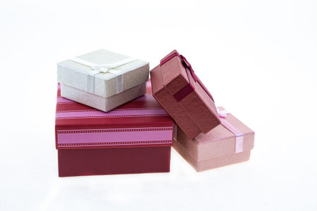 Gifts in holiday boxes on isolated white background, giftbox stacked