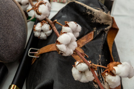 white cotton flower on the background of leather bagsの写真素材