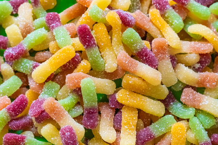 colored gummy candy worms bicolor background confectionery