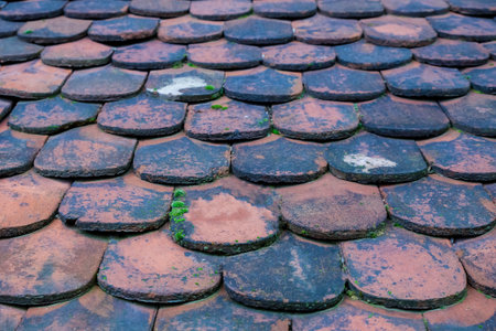 old wooden roof close-up, Asia weathered roof tile plateの写真素材