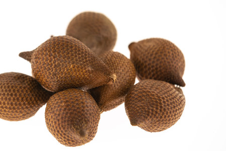 slide brown snake fruit Salaka spread in the markets of Asia on a white isolated backgroundの写真素材