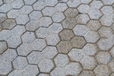 gray stone tiles background polyhedral pattern urban designの写真素材