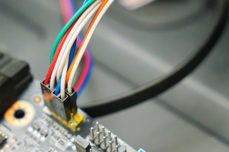 motherboard with wires and post code close up computer backgroundの写真素材