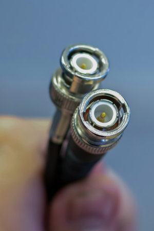 coaxil wire two outputs in the hands close-upの写真素材