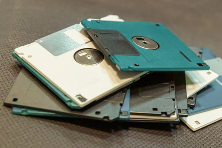 many floppy disks for storing information. symbol of storing and saving information on a computerの写真素材