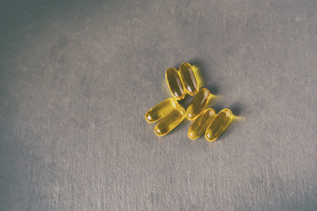 The pills are small and round. Concept of health and wellness