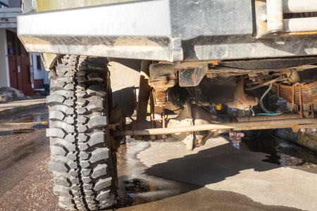 old car suspension from below. car transmission and wheels
