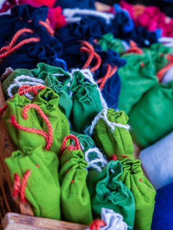 A wooden crate with green and white bagsの写真素材