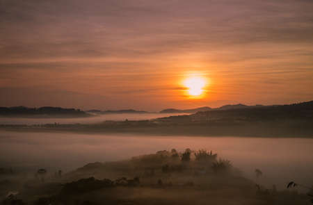 Beautiful nature sunrise Mountain Morning view point, Sun rises, at khao kho Thailand.の写真素材
