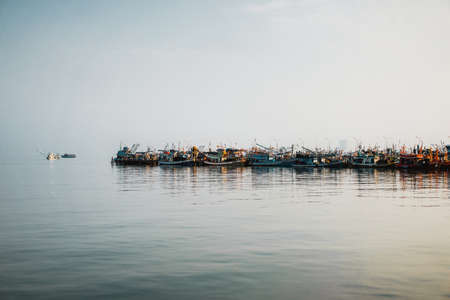 Chonburi Thailand - January 23, 2018; Beautiful sunrise,  Thai  Fishing boat is out fishing. Fishermen is a career that has been popular in the seaside city of Thailand.のeditorial素材