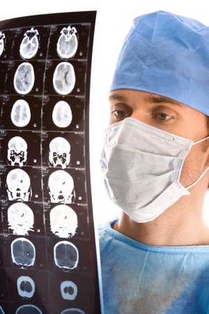 young male doctor examining the tomogramの写真素材