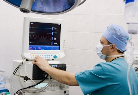 anesthesiologist with equipment in operation roomの写真素材