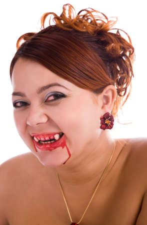 laughing funny vampire woman with fresh blood on the lipsの写真素材