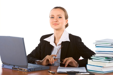 young successful businesswoman with laptop and spectaclesの写真素材