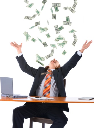 young businessman in office and falling money, isolated on white backgroundの写真素材