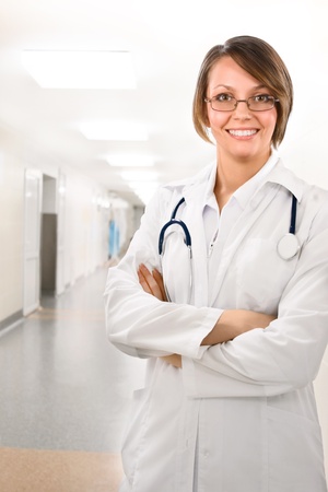 Young attractive doctor in clinic under lampsの写真素材