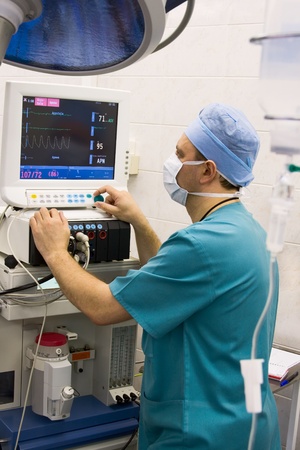 anaesthetist at monitor in operation roomの写真素材
