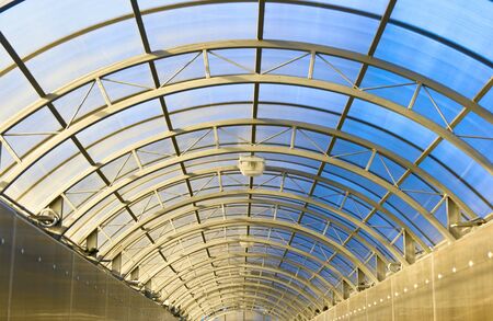 arch of long tunnel with glass ceilingの写真素材