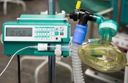 anesthesiologist's working tools: syringe pump and maskの写真素材
