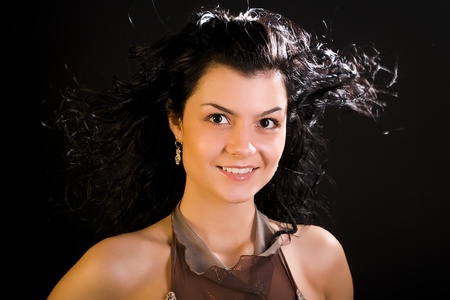 young attractive jewess woman with long hairs on black backgroundの写真素材