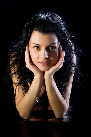 young attractive women with shining hairs on black backgroundの写真素材