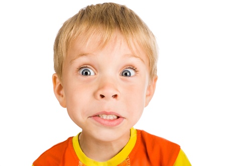 very surprised five-year-old boy isolated on white backgroundの写真素材