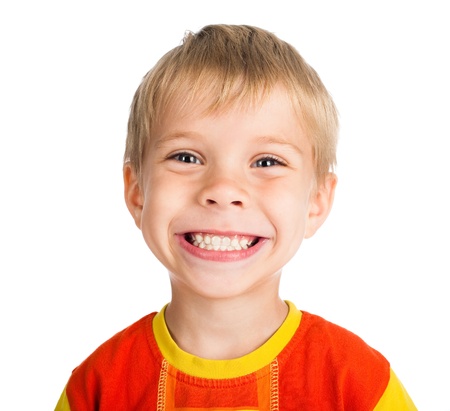 happy smiling five-year-old boy isolated on white backgroundの写真素材