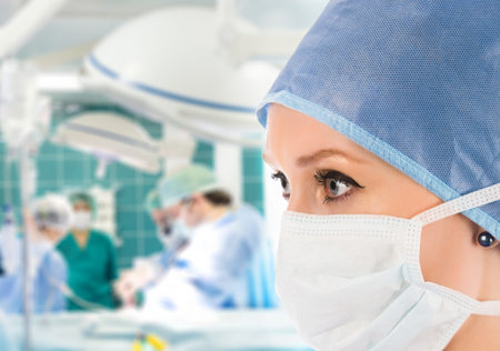 female surgeon with surgical team on background