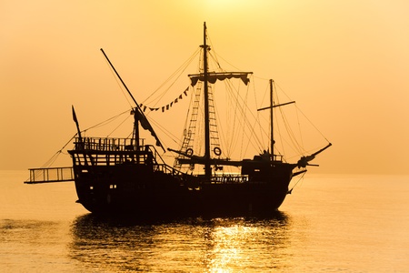 Schooner silhouette at sunsetの写真素材