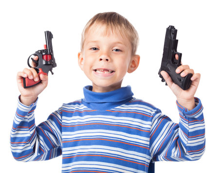 expressive little boy with two gunsの写真素材