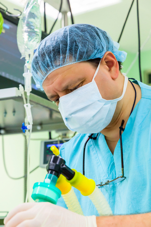Anesthesiologist working in operation roomの写真素材