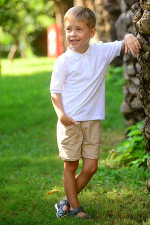Portrait of young smiling boy in outdoors. Image with shallow DOF.の写真素材